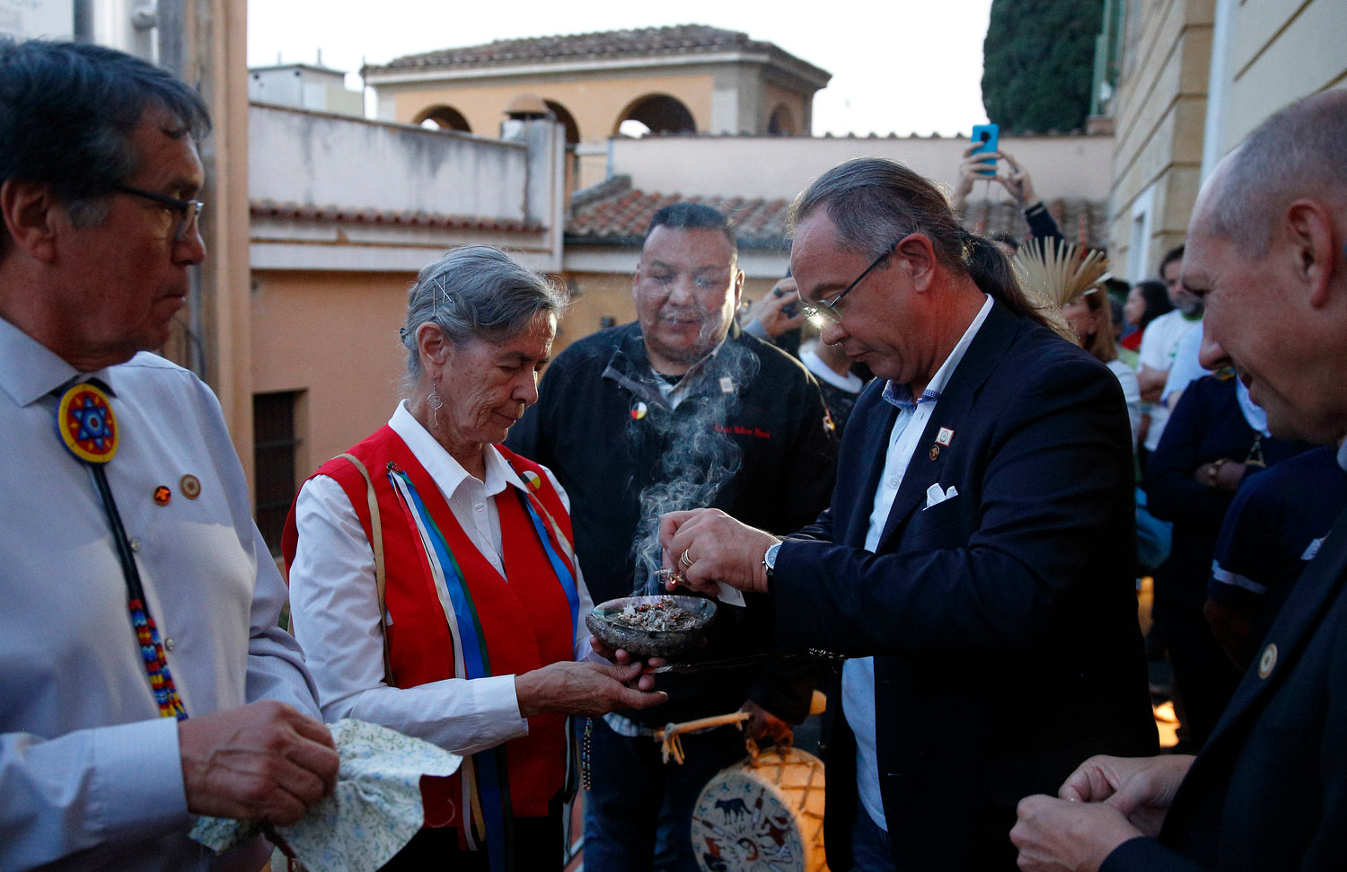 Sister Priscilla Soloman, a member of the Ojibway people and of the Sisters of St. Joseph of Sault Ste. Marie in Ontario, Canada, and Alessandro Martire, a lawyer for the Lakota Sioux, participate in an indigenous prayer at the Jesuit General Curia in Rome Oct. 17, 2019. Both participated in a meeting of indigenous peoples from North America and South America that was a side event to the Synod of Bishops for the Amazon.